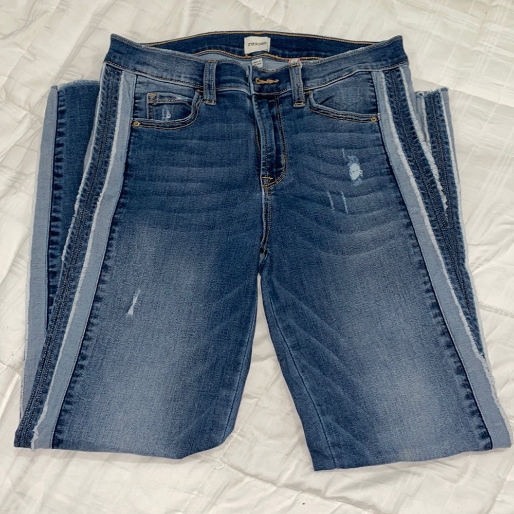 Sneak peek mid rise skinny jeans